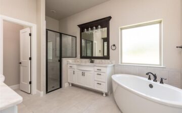 photo of the interior bathroom of a home showing a shower, sink, and bathtub