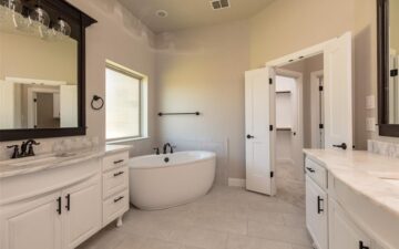 photo of a bathroom interior of a home for sale showing a sink and bathtub