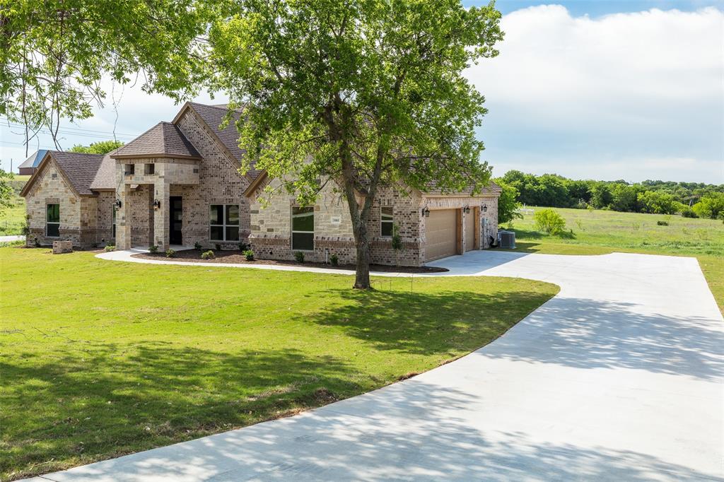 photo of a driveway leading up to a home for sale